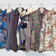 A row of Randy Pitchford's used shirts hang on a rail.